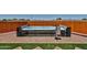 Luxury hot tub features a towel rack and removable side panels situated on a paver and artificial grass patio at 29408 N 224Th Dr, Wittmann, AZ 85361