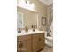 Well-appointed bathroom with a double sink vanity and a modern shower-tub combo at 37795 W Padilla St, Maricopa, AZ 85138