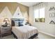 Charming bedroom with playful decor and a comfortable bed at 37795 W Padilla St, Maricopa, AZ 85138