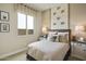 Cozy bedroom featuring a comfortable bed and tasteful equestrian-themed decor at 37795 W Padilla St, Maricopa, AZ 85138