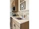 Close-up of the stylish kitchenette featuring a modern faucet and sleek countertops at 37795 W Padilla St, Maricopa, AZ 85138