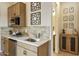Well-equipped kitchenette features sleek countertops, wooden cabinets, and stylish decorative accents at 37795 W Padilla St, Maricopa, AZ 85138