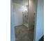 Bright bathroom featuring a walk-in shower with tile flooring at 38105 W Bello Ln, Maricopa, AZ 85138