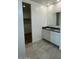 Bright bathroom featuring double sinks and sleek tile flooring at 38105 W Bello Ln, Maricopa, AZ 85138