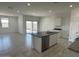 Bright kitchen featuring an island, stainless appliances, and a modern design at 38105 W Bello Ln, Maricopa, AZ 85138