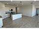 Open-concept kitchen featuring a central island, and white cabinetry at 38105 W Bello Ln, Maricopa, AZ 85138