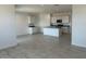 Open-concept living space with tile flooring, recessed lighting, and a stylish kitchen island at 38105 W Bello Ln, Maricopa, AZ 85138