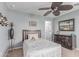 Cozy bedroom with a ceiling fan, decorative accents, and plenty of light at 41448 N Eliana Dr, Queen Creek, AZ 85140