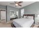 Comfortable bedroom featuring a cozy bed, mirrored closet doors and bright natural lighting at 41448 N Eliana Dr, Queen Creek, AZ 85140
