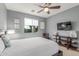 Relaxing bedroom bathed in natural light, complemented by sleek modern decor and stylish furnishings at 41448 N Eliana Dr, Queen Creek, AZ 85140