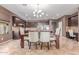 Elegant dining room boasting stylish lighting and a view of the kitchen, perfect for entertaining at 41448 N Eliana Dr, Queen Creek, AZ 85140