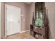 Charming entryway with elegant tile flooring, decorative accents and a convenient storage unit at 41448 N Eliana Dr, Queen Creek, AZ 85140