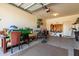 Spacious garage featuring ample storage, workout equipment, and a well-organized workspace, perfect for hobbies at 41448 N Eliana Dr, Queen Creek, AZ 85140