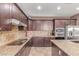 This kitchen has wooden cabinets and stainless-steel appliances at 41448 N Eliana Dr, Queen Creek, AZ 85140