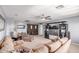 Expansive living room featuring a plush sectional sofa, ceiling fan, and neutral decor at 41448 N Eliana Dr, Queen Creek, AZ 85140