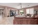Spacious living room featuring a modern entertainment center and sliding glass doors to the backyard at 41448 N Eliana Dr, Queen Creek, AZ 85140