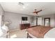 Inviting main bedroom with a ceiling fan, stylish decor, and plenty of natural light at 41448 N Eliana Dr, Queen Creek, AZ 85140