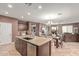 This open concept includes the kitchen, dining room, and living room at 41448 N Eliana Dr, Queen Creek, AZ 85140