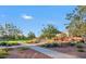 Inviting playground situated in a community park with tree lined walkways and ample green space at 41448 N Eliana Dr, Queen Creek, AZ 85140