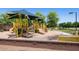 Outdoor playground area featuring slides, climbing structures, and shaded seating for safe, fun play at 41448 N Eliana Dr, Queen Creek, AZ 85140
