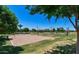 Community recreation area with volleyball court, basketball courts, and green spaces at 41448 N Eliana Dr, Queen Creek, AZ 85140
