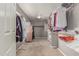 Organized walk-in closet with ample hanging space and shelving at 41448 N Eliana Dr, Queen Creek, AZ 85140