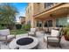 Inviting backyard with fire pit, covered patio, and lush lawn at 4615 E Navigator Ln, Phoenix, AZ 85050