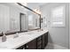 Bathroom features a dual sink vanity, large mirror, and neutral color palette at 4615 E Navigator Ln, Phoenix, AZ 85050