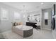 Luxurious bathroom with tiled floors, soaking tub, and elegant chandelier lighting at 4615 E Navigator Ln, Phoenix, AZ 85050