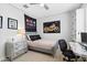 Fun bedroom with motorcycle art, stylish desk, and quirky 'Astro World' banner at 4615 E Navigator Ln, Phoenix, AZ 85050