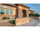 Beautiful clubhouse entrance with stone accents and lush landscaping at 4615 E Navigator Ln, Phoenix, AZ 85050