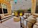 Charming courtyard with decorative lighting, lush plants, and stylish seating at 4615 E Navigator Ln, Phoenix, AZ 85050