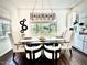 Elegant dining room featuring a modern chandelier and a window view at 4615 E Navigator Ln, Phoenix, AZ 85050