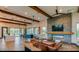 Spacious living room features stone fireplace and stylish furnishings at 4615 E Navigator Ln, Phoenix, AZ 85050