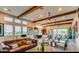 Bright living room featuring high ceilings, wood beams, and an open floor plan at 4615 E Navigator Ln, Phoenix, AZ 85050