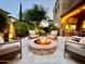 Cozy outdoor patio with a central fire pit and comfortable seating under the stars at 4615 E Navigator Ln, Phoenix, AZ 85050
