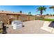 Gravel filled backyard featuring a block wall and planters under a bright blue sky at 5302 W Poinsettia Dr, Glendale, AZ 85304