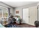 Well-lit bedroom with a window, workspace, and closet at 5302 W Poinsettia Dr, Glendale, AZ 85304
