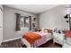 Charming bedroom with a bed, soft decor, and hardwood floors at 5302 W Poinsettia Dr, Glendale, AZ 85304