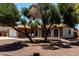 Lovely single-Gathering home with mature trees, gravel landscaping, and a cozy front sitting area at 5302 W Poinsettia Dr, Glendale, AZ 85304