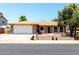 Charming single-story brick home featuring a well-maintained yard and a two-car garage at 5302 W Poinsettia Dr, Glendale, AZ 85304