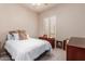 Cozy bedroom with a neutral palette and natural light from the window at 5372 S Cat Claw Dr, Gold Canyon, AZ 85118