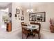 Cozy dining area with a charming table setting and decorative mirror at 5372 S Cat Claw Dr, Gold Canyon, AZ 85118