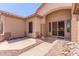 Welcoming home entrance featuring a security door and desert landscaping at 5372 S Cat Claw Dr, Gold Canyon, AZ 85118