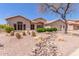 Beautiful desert home featuring rocks, cacti, and desert landscaping at 5372 S Cat Claw Dr, Gold Canyon, AZ 85118