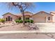 Charming single-story home with a well-manicured desert landscape and tile roof at 5372 S Cat Claw Dr, Gold Canyon, AZ 85118