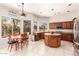 Inviting eat-in kitchen with stainless steel appliances and warm wooden cabinetry at 5372 S Cat Claw Dr, Gold Canyon, AZ 85118