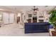 Spacious living room with a cozy fireplace and comfortable seating arrangement at 5372 S Cat Claw Dr, Gold Canyon, AZ 85118