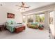 Large primary bedroom has natural light from many windows and a ceiling fan at 5372 S Cat Claw Dr, Gold Canyon, AZ 85118