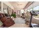 Inviting sunroom with large windows, comfortable seating, and exercise equipment at 5372 S Cat Claw Dr, Gold Canyon, AZ 85118
